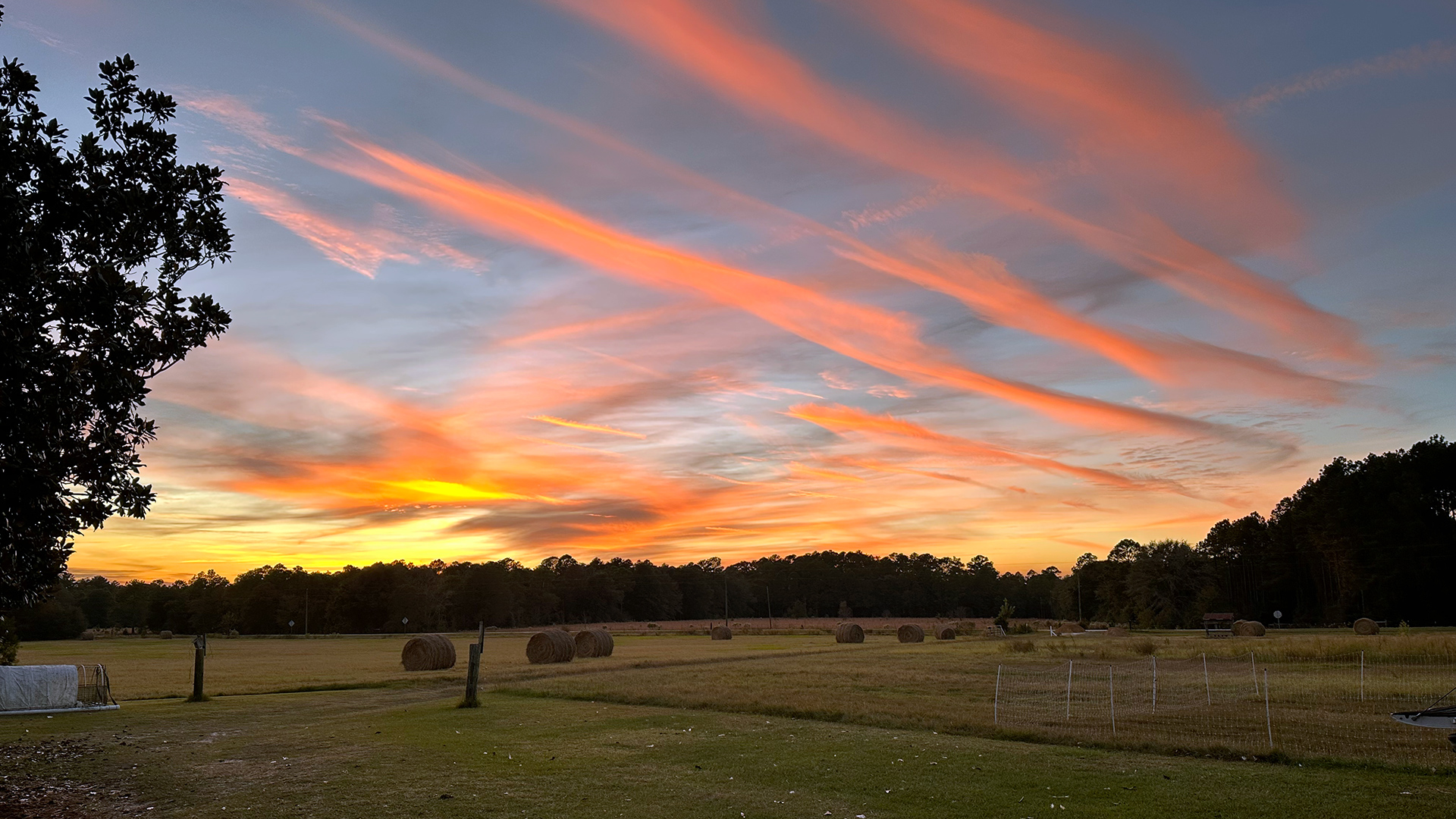 CONDENSED-Sunset-with-hay-in-fields