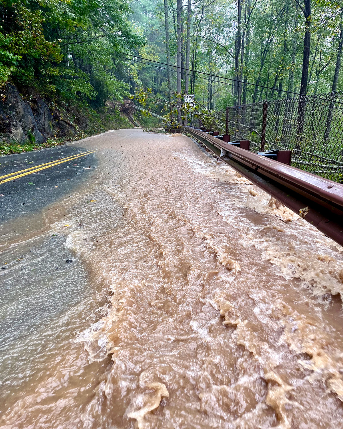 A flooded rural two-lane near Banner Elk, North Carolina