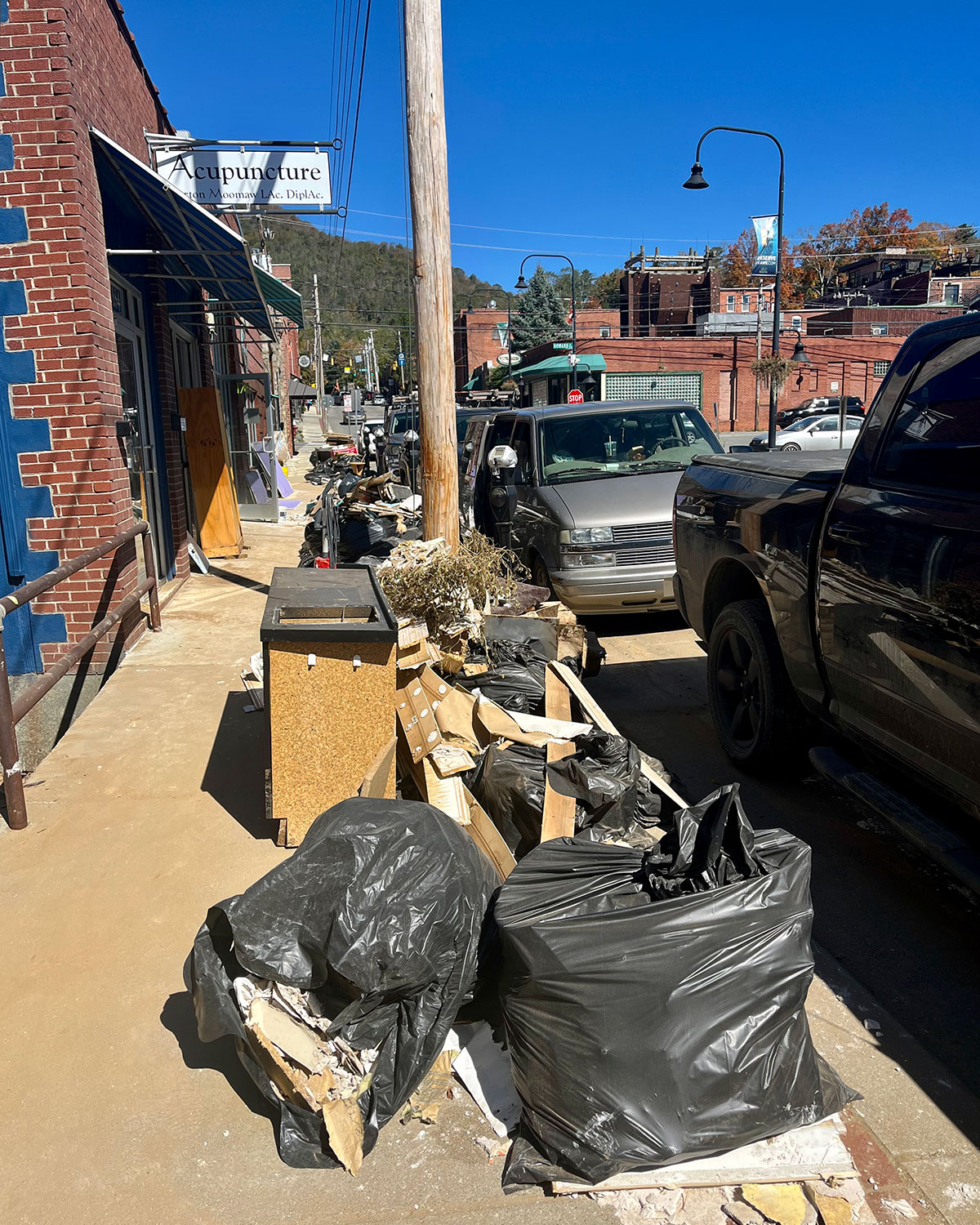 Store owners in downtown Boone filled the sidewalks with bags of debris.