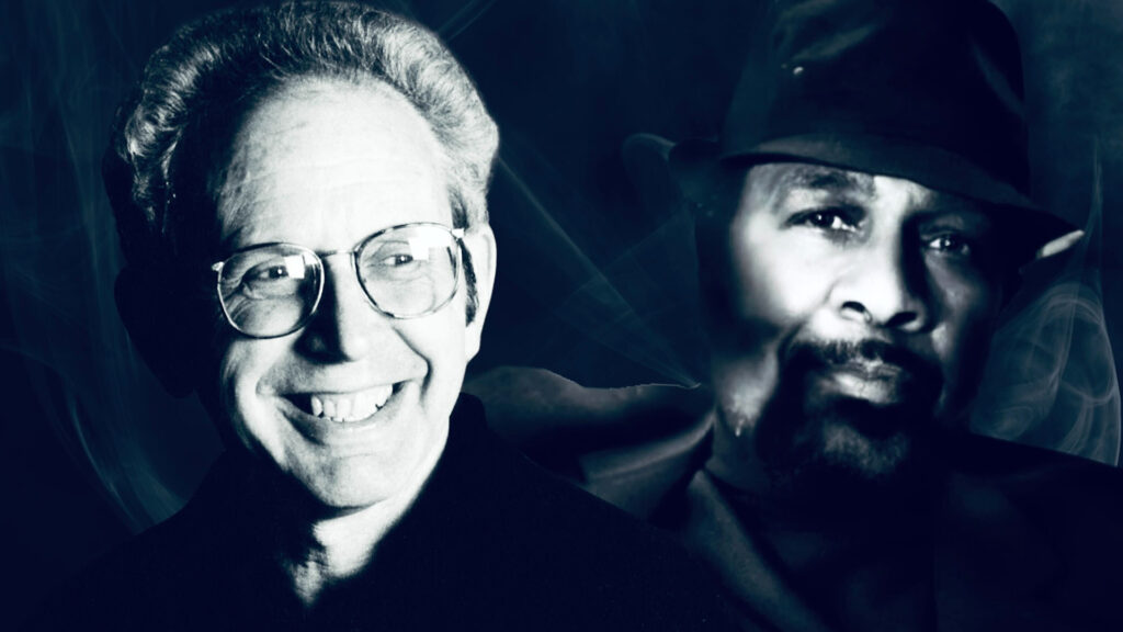 A black and white duotone photograph showing two men in a side-by-side portrait composition. On the left is music historian Peter Guralnick, a smiling man with glasses and light-colored hair, while on the right is soul-music legend William Bell wearing a dark fedora and sporting a neatly trimmed beard, photographed in dramatic lighting that emphasizes his thoughtful expression.