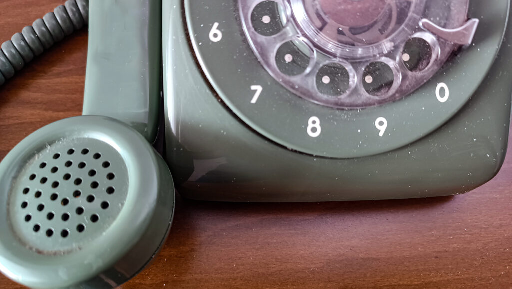 Close-up of a rotary phone accompanying Limping Along, a poetry collection by North Carolina poet Joseph Mills exploring time, memory, and resilience. Joseph Mills poetry.